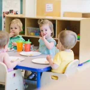 Children exploring sensory materials in a Montessori classroom.