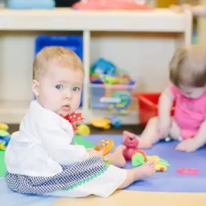 Montessori classroom featuring children working on art and crafts projects.