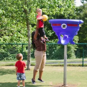 Children learning through discovery in a Montessori outdoor environment.